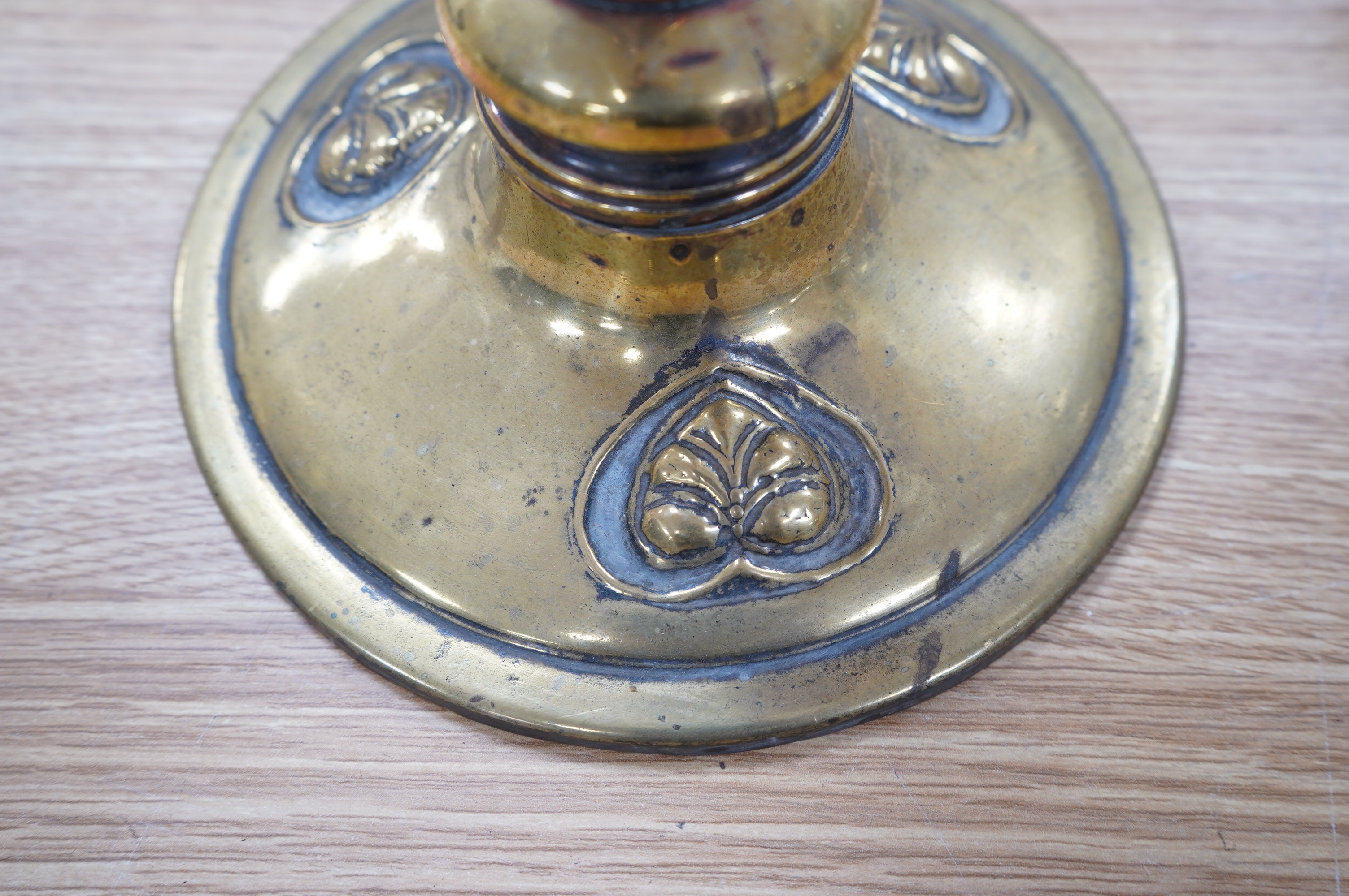 An English Arts and Crafts oil lamp with frosted acid etched shade, chimney, overall 74cm high. Condition – areas of old copper plating showing otherwise in good condition